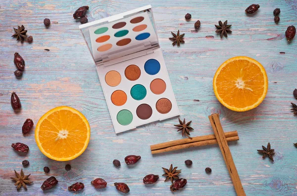 Fashion summer eye palettes with  fruit and spices at blue woode — Stock Photo, Image