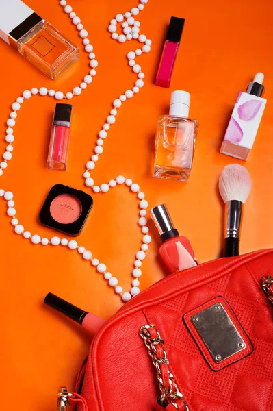 flat lay fashionable lady set around orange background