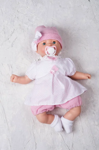 Cute baby doll tot with dummy around white background — Stok Foto