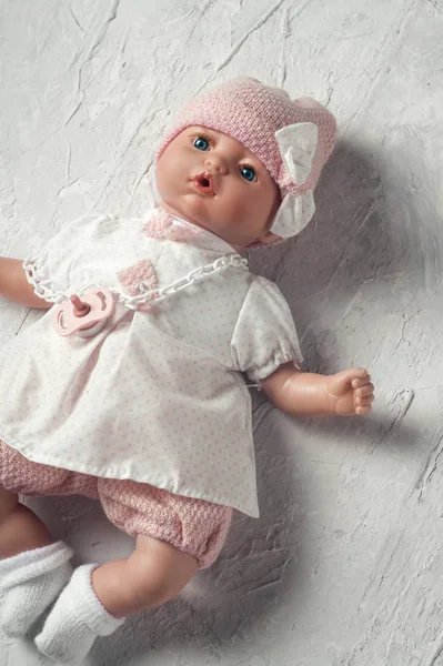 Cute baby doll tot with dummy around white background — Stok Foto