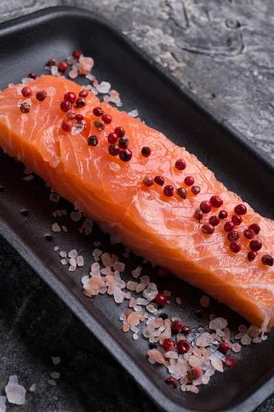 Raw fillet of salmon. Fresh salted and beautiful salmon fillet o