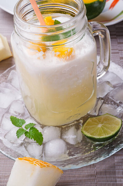 fresh vegetarian tropical melon cocktail with coconut milk and m