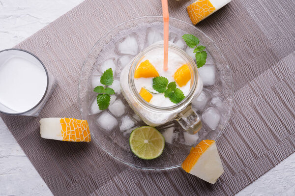 fresh vegetarian tropical melon cocktail with coconut milk and m
