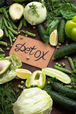 detox green vegetables lifestyle  concept. various fresh green vegetables at wooden table. flat lay