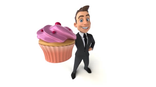 Διασκεδαστικός Επιχειρηματίας Κρατώντας Cupcake — Αρχείο Βίντεο