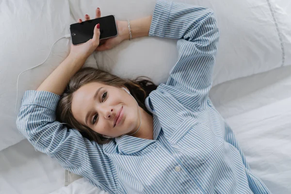 Relaxation Concept Pretty Girl Pleased Satisfied Expression Dressed Pyjamas Rests — Stock Photo, Image