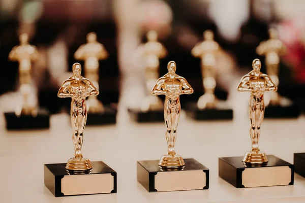 Oscar award. Prize for victory. Golden trophy,. Success concept. Horizontal shot. Prize in film production — Stock Photo, Image