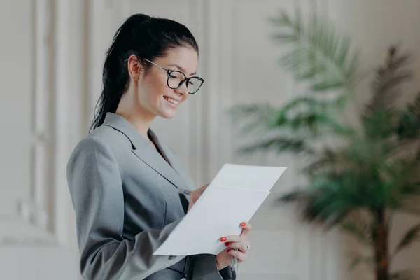 Glad Female Lawyer Writes Corporate Paper Documents Wears Optical Glasses — Stock Photo, Image