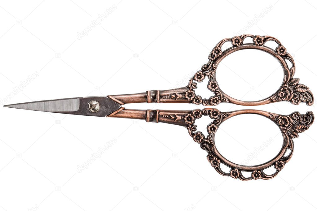 Scissors with curly handles from bronze, isolated on white background