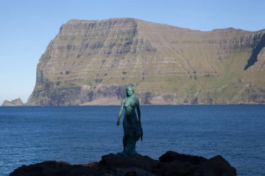 Mikladalur, Kalsoy, Faroe Islands - 20 September 2019: The Seal Woman monument clipart