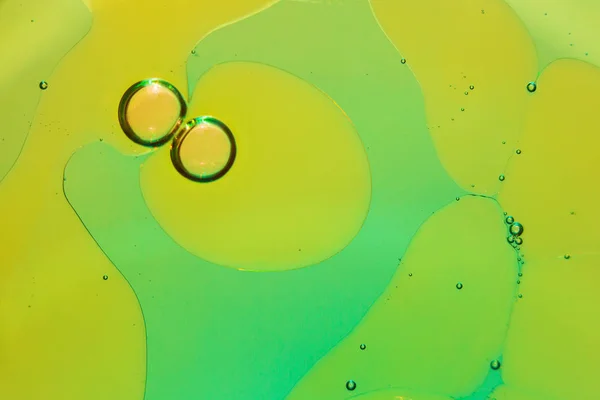 Abstract background with oil droplets on water surface