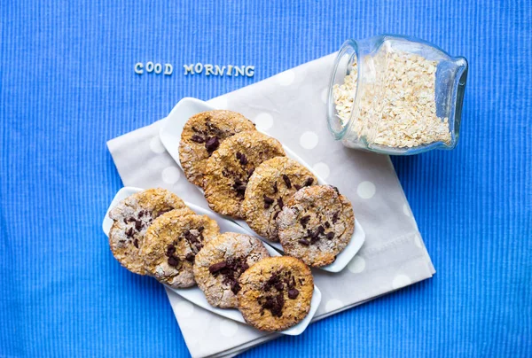 Oatmeal cookies in a white plate that says good morning — Stock Photo, Image