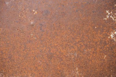 Koyu turuncu paslı metal doku arka plan aşınmış.
