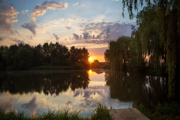 Gorgeous sunset on a small fishing lake — Stock Photo, Image