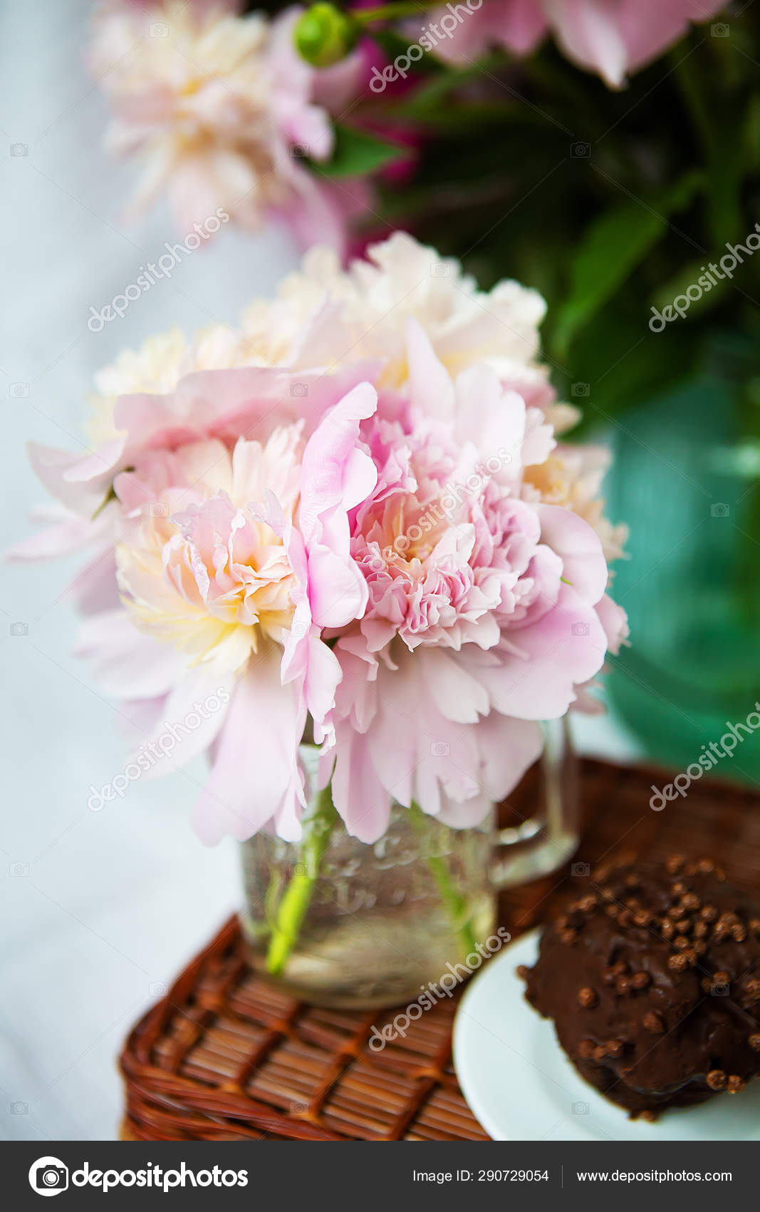 A Very Beautiful Bouquet Of Pink Peonies In A Vase Stands On A