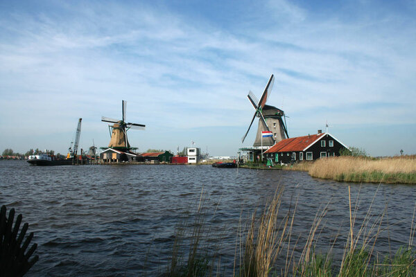 Netherlands,Holland,Dutch,North Holland,Open Air Museum, The Zaanse Schans, may 2015: river De Zaan borders the Open Air Museum