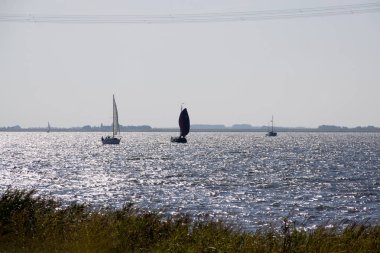 Netherlands,Noordoostpolder, july 2017:The Ketelmeer is navigated by the commercial shipping as well as by the boating clipart