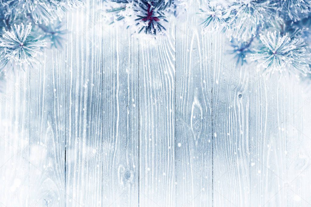 Winter background over wooden texture 