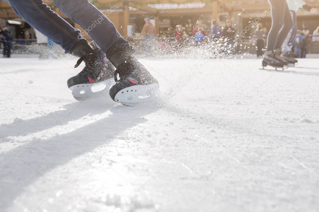 People ice skating on ice rink 