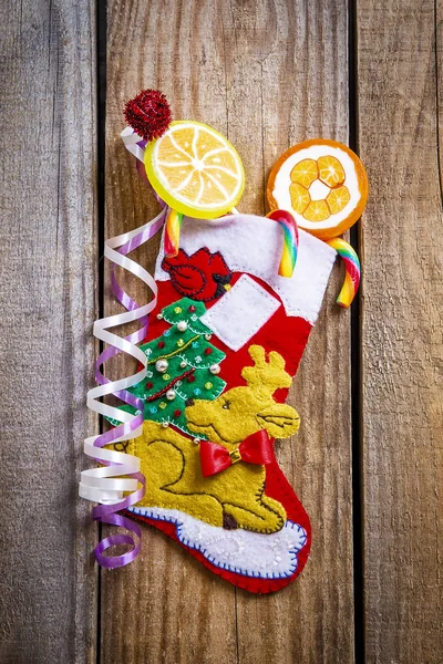 Christmas stocking hanging on the wooden wall — Stock Photo, Image