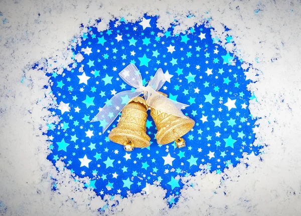 Bells with Christmas decoration on blue background — Stock Photo, Image