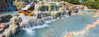 Natural spa with waterfalls  and hot springs at Saturnia thermal baths, Grosseto, Tuscany, Italy clipart