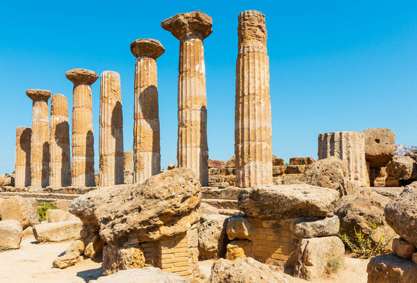 Ruined Temple of Heracles columns in famous ancient Valley of Temples, Agrigento, Sicily, Italy. UNESCO World Heritage Site.