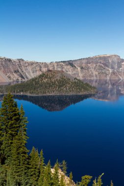 Beautiful day at Crater Lake National Park with clear skies and very little wind with meant awesome reflections that day clipart