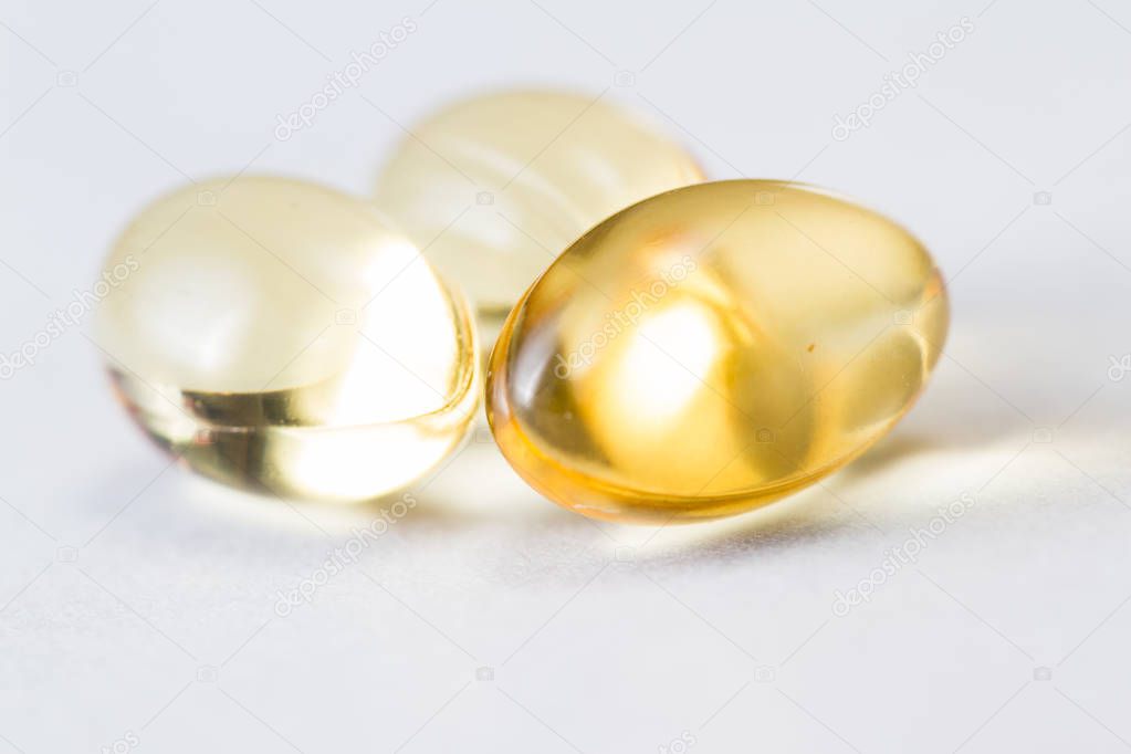 close up of CBD oil capsules made from hemp isolated on a white background