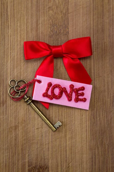 Conceptual Image Using Red Bow Old Key Pink Tag Red — Stock Photo, Image