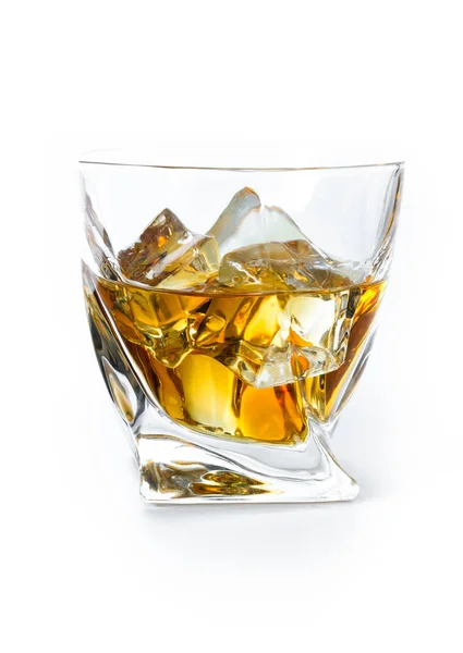 Close up of a tumbler glass with straight Kentucky bourbon served on the rocks isolated on a white background