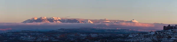 Snowy mountains at sunset — Stock Photo, Image