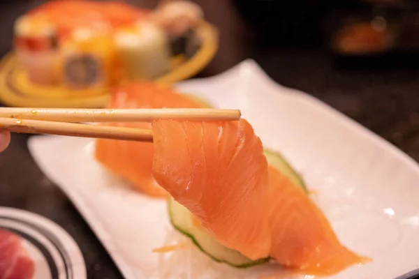 Raw salmon slice or salmon sashimi in Japanese style.