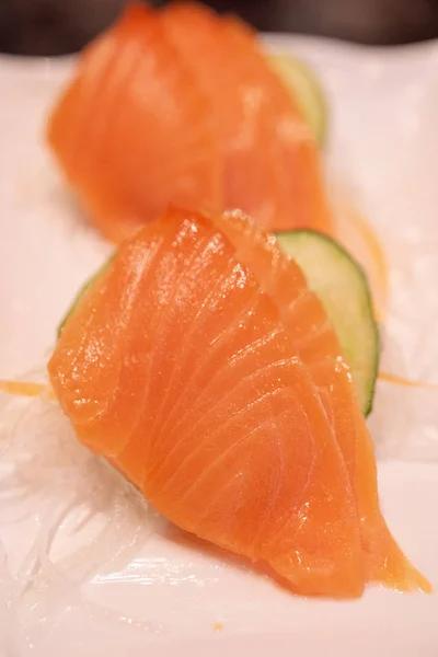 Raw salmon slice or salmon sashimi in Japanese style.
