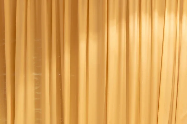 Brown curtains background. Transparent curtain on window.