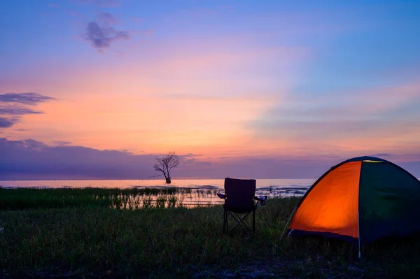 Tent and chairs by the lake — ストック写真