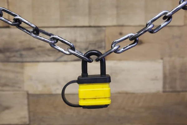 Security Series Chained Yellow Padlock Wooden Background — Stock Photo, Image