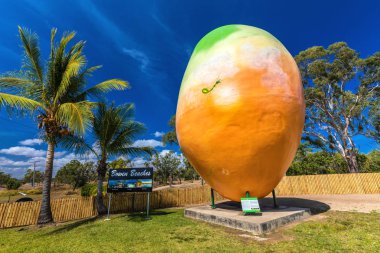 BOWEN, AUS - SEPT 18 2017: Bowen's famous attraction Big Mango located at Visitor Information Center. Queensland, Australia. clipart
