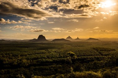 Panoramic view of Glass House Mountains at sunset visible from Wild Horse Mountain Lookout, Australia clipart
