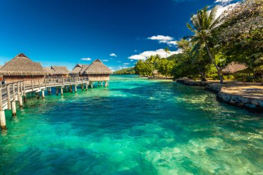 Over water bungalow with steps into amazing lagoon, Moorea, Tahiti clipart