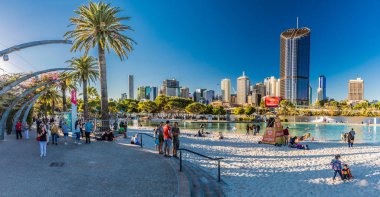 BRISBANE, AUS - AUG 12 2018: Streets Beach in South Bank Parkland. It's inner-city man-made beach next to city center. clipart