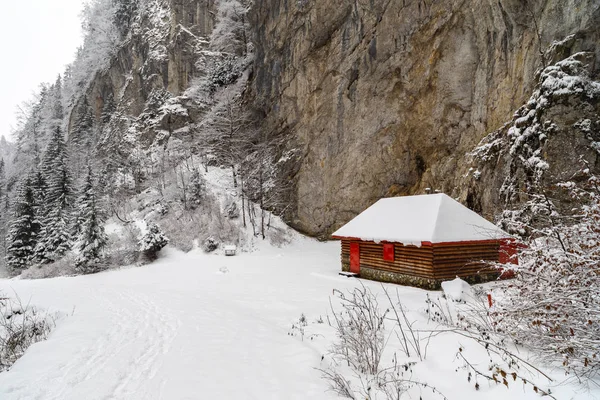 Wooden shelter or barn in the mountains during winter time