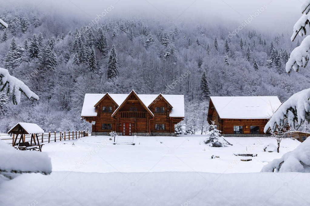 Wooden house in the mountains during winter