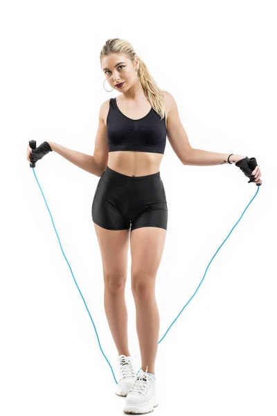 Beautiful sportsgirl with skipping rope isolated on white — Stock Photo, Image