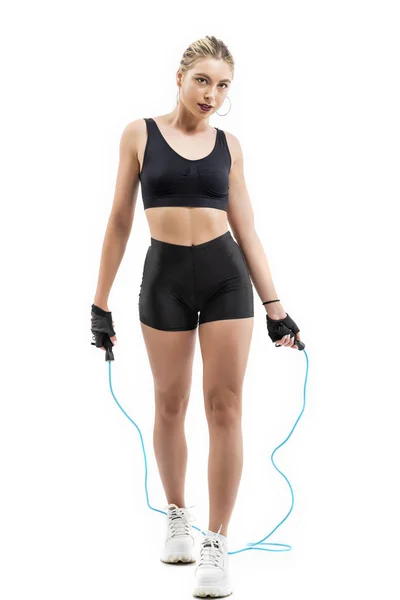 Beautiful sportsgirl with skipping rope isolated on white — Stock Photo, Image
