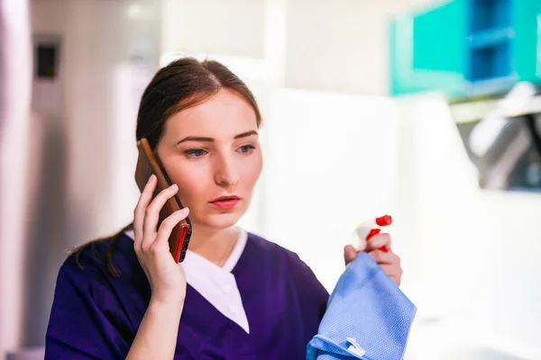 Woman Cleaning Service Uniform Using Mobile Phone — Stock Photo, Image