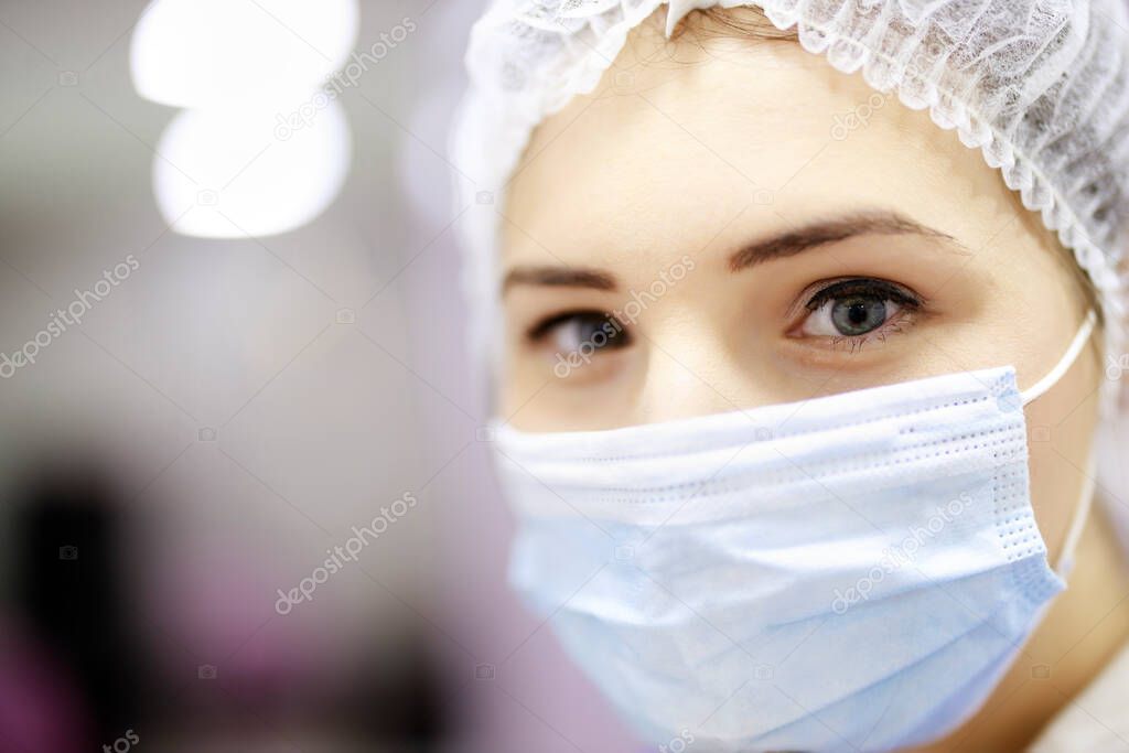 asian woman patient look to you with facial mask in hospital