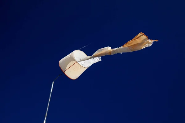 Torn Windsock Dark Blue Sky Storm Aftermath Background — Stock Photo, Image