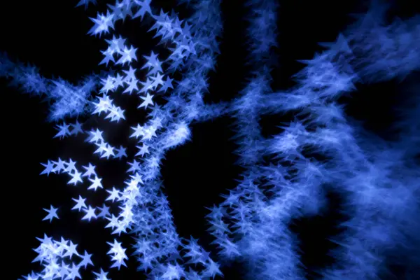 クリスマスの星の背景 特殊なボケ味に及ぼすブラック — ストック写真