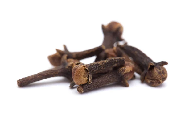 Few cloves on white — Stock Photo, Image